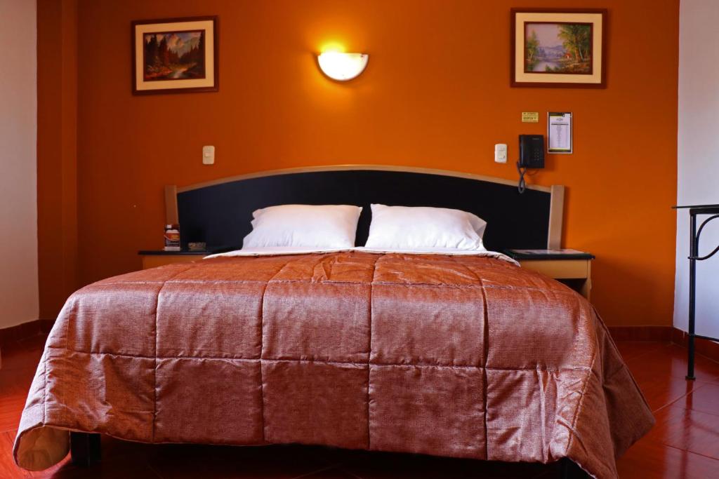 Postel nebo postele na pokoji v ubytování Hotel Bohemia