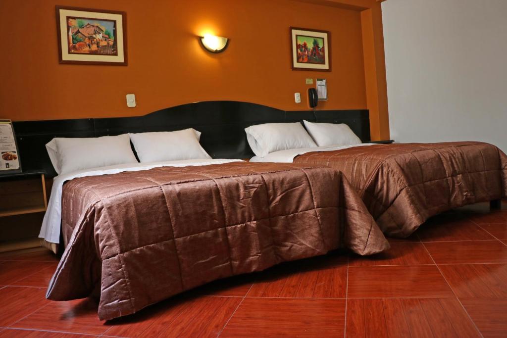 Postel nebo postele na pokoji v ubytování Hotel Bohemia