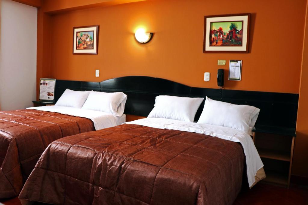 Postel nebo postele na pokoji v ubytování Hotel Bohemia
