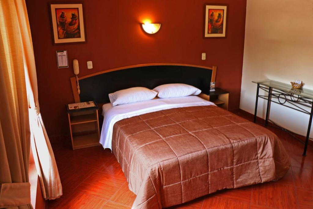 Postel nebo postele na pokoji v ubytování Hotel Bohemia