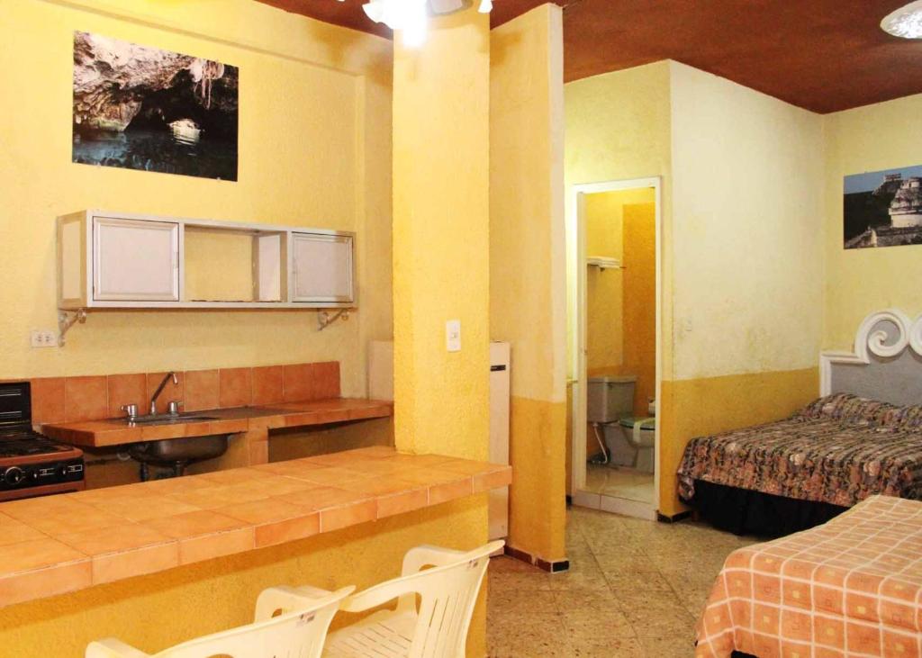 Kuchyň nebo kuchyňský kout v ubytování Hotel Suites Elia Noemi