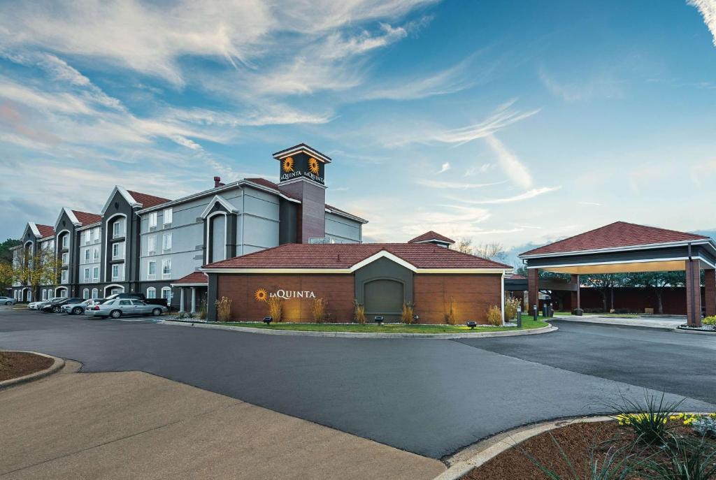 a building with a clock tower on a street at La Quinta by Wyndham Shreveport Airport in Shreveport