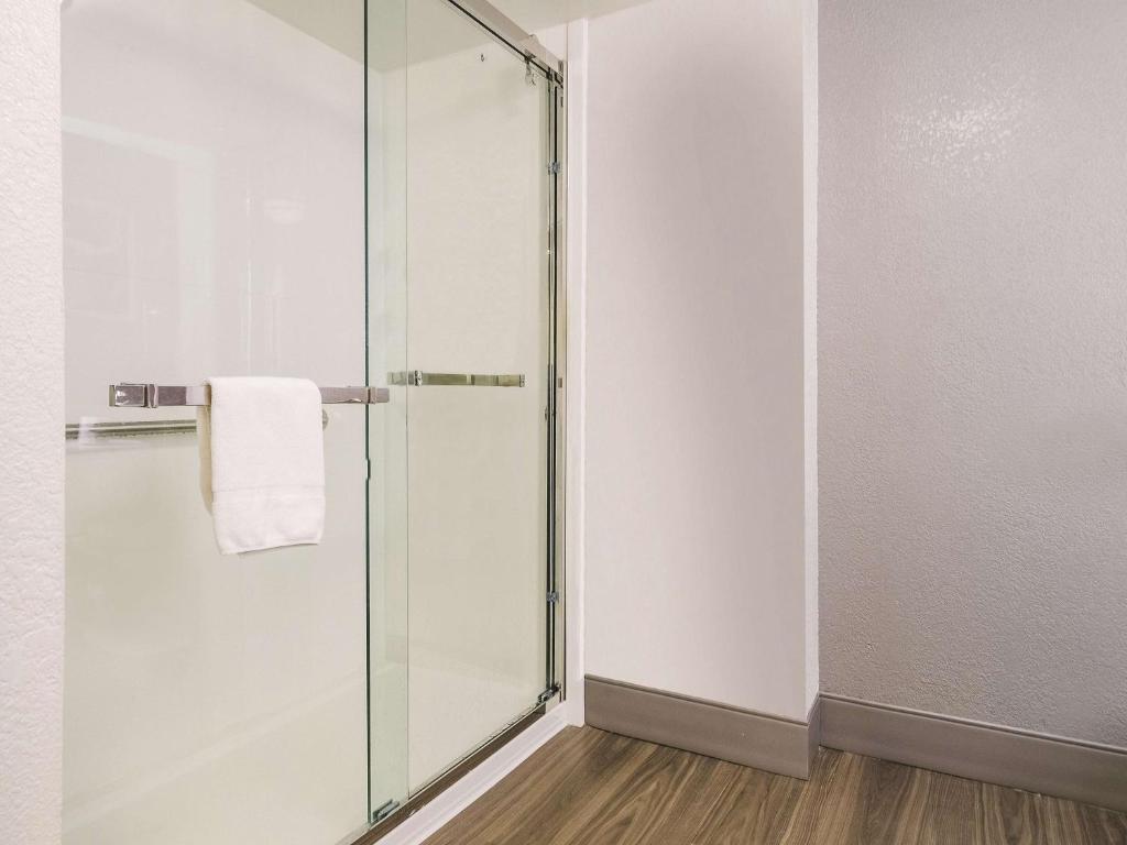 a shower with a glass door in a bathroom at La Quinta by Wyndham Myrtle Beach - N. Kings Hwy in Myrtle Beach