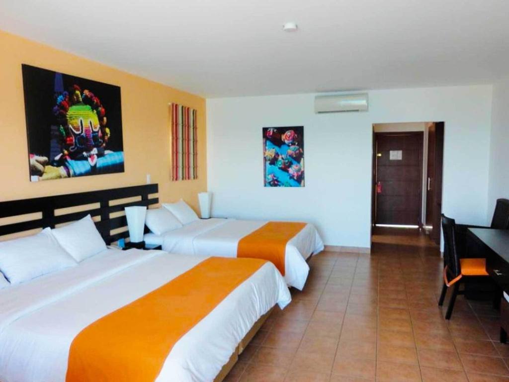 Postel nebo postele na pokoji v ubytování Royal Decameron Mompiche - All Inclusive