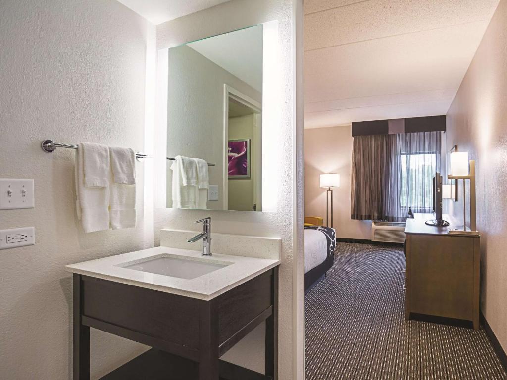 a bathroom with a sink in a hotel room at La Quinta by Wyndham Myrtle Beach - N. Kings Hwy in Myrtle Beach