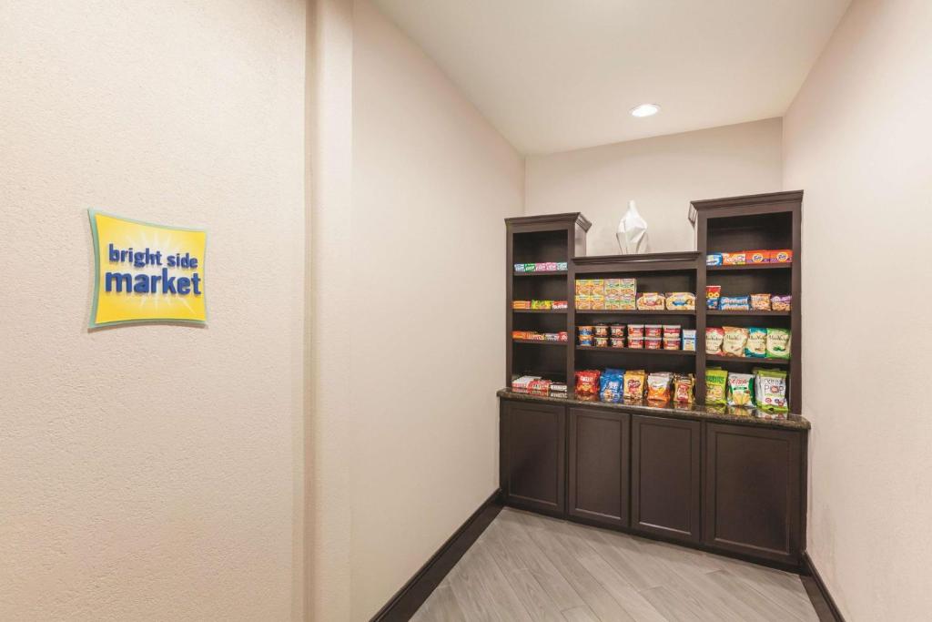 a walk in pantry at a store at La Quinta by Wyndham Houston IAH Bush Intl Airport E in Humble