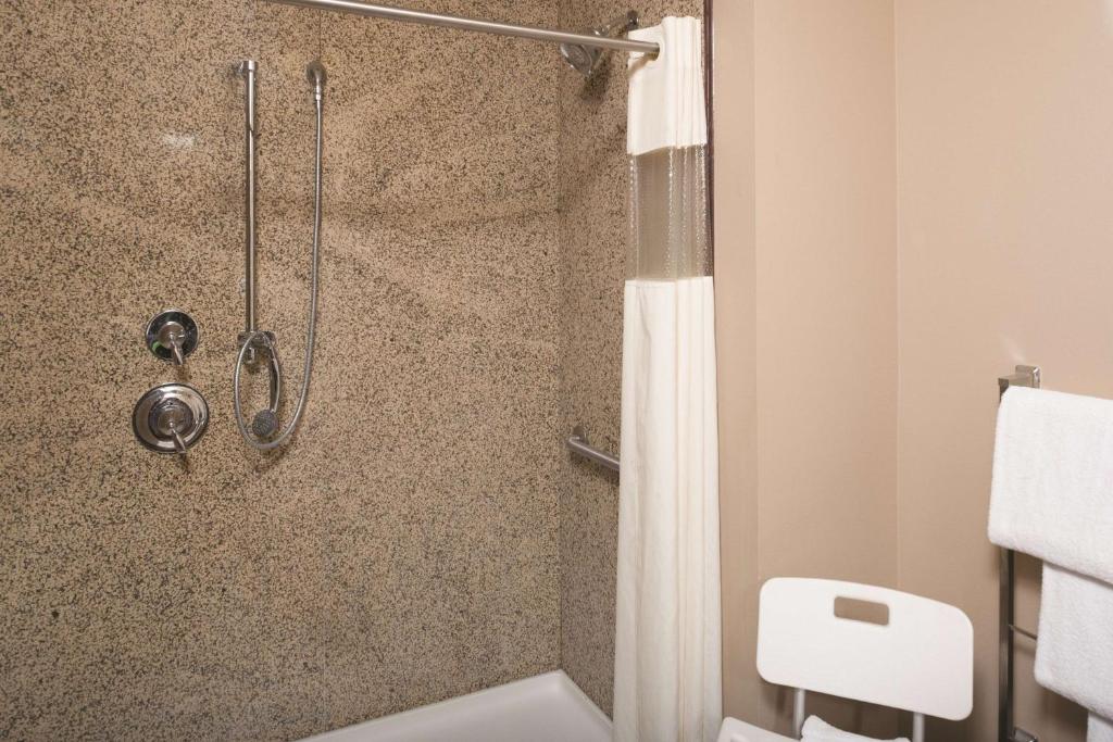 a bathroom with a shower stall and a toilet at La Quinta by Wyndham Bozeman in Bozeman