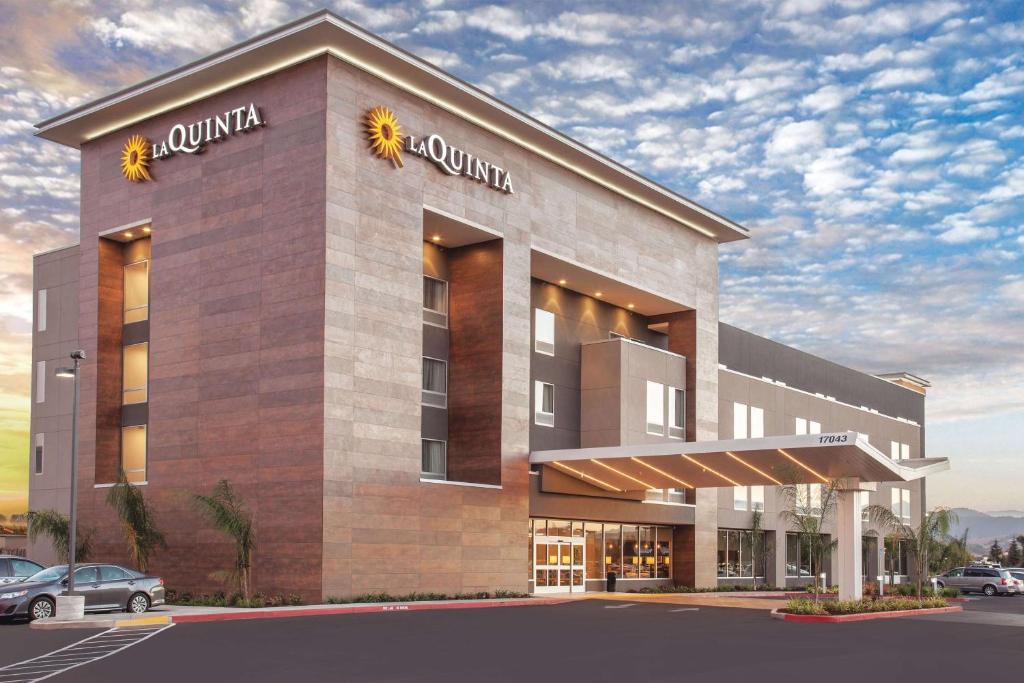 a rendering of a hotel with a building at La Quinta by Wyndham Morgan Hill-San Jose South in Morgan Hill