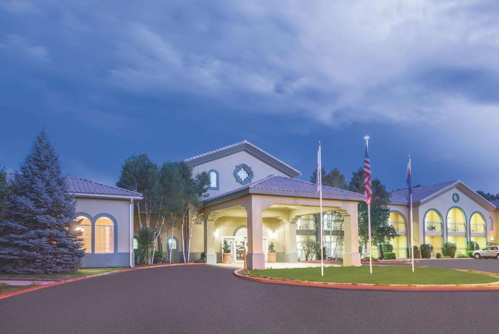 a rendering of a house with a flag in front at La Quinta by Wyndham Conference Center Prescott in Prescott