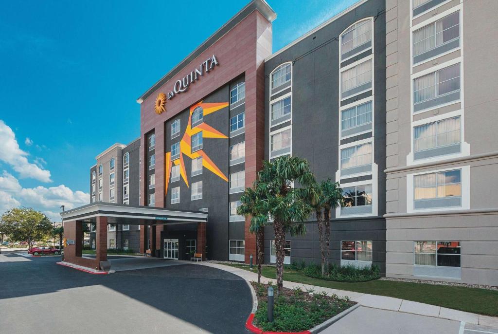 a large building with a large clock on the front of it at La Quinta Inn & Suites by Wyndham San Antonio Downtown in San Antonio