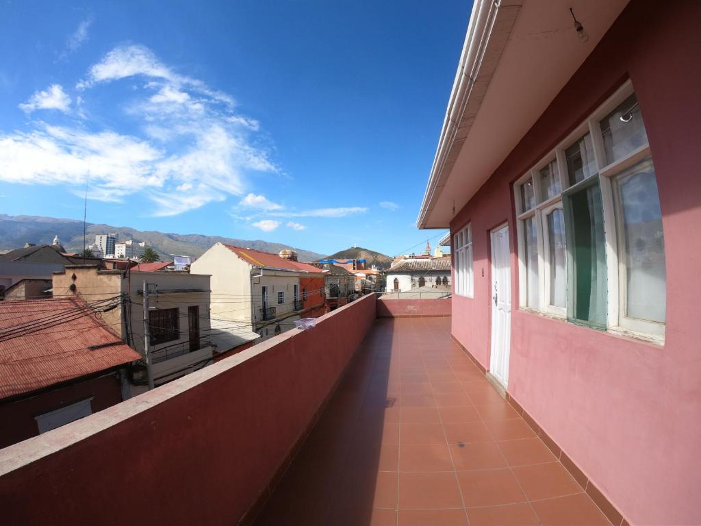 a view from the balcony of a pink building at Vila Festiva Cochabamba céntrica in Cochabamba
