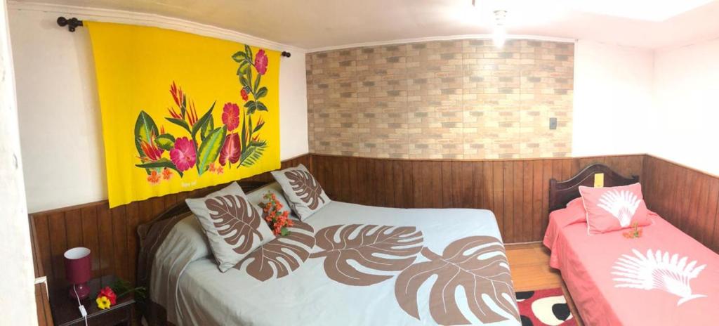 Postel nebo postele na pokoji v ubytování Hostal Vaihere