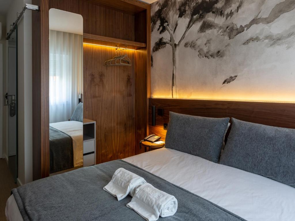 Postel nebo postele na pokoji v ubytování Hotel Afonso V & SPA
