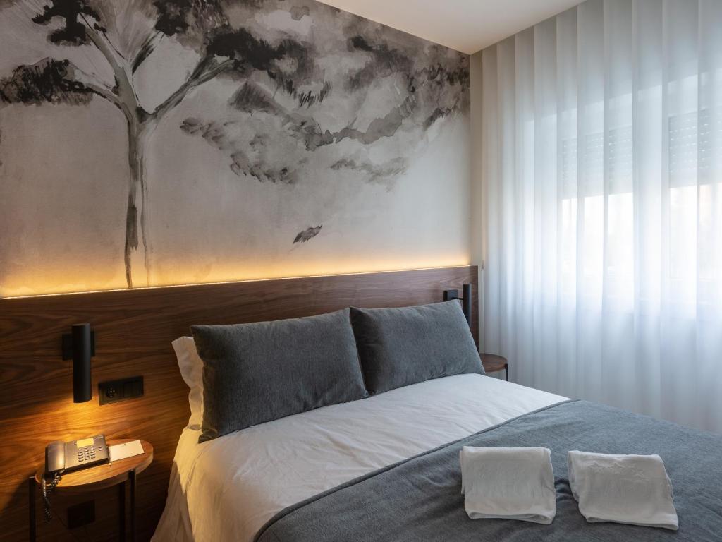 Postel nebo postele na pokoji v ubytování Hotel Afonso V & SPA