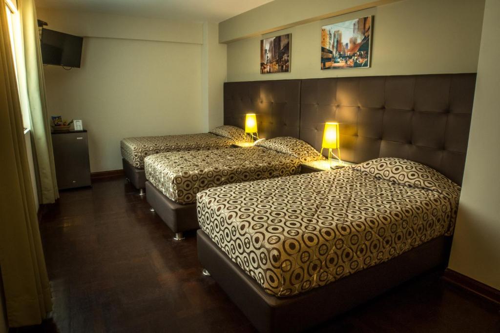 Postel nebo postele na pokoji v ubytování Hotel Lexus