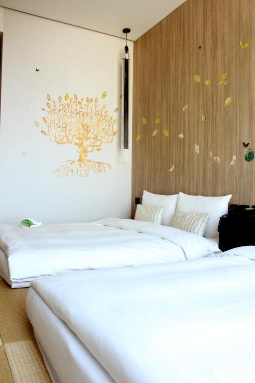 Voodi või voodid majutusasutuse Hotel Day Plus Teascape toas