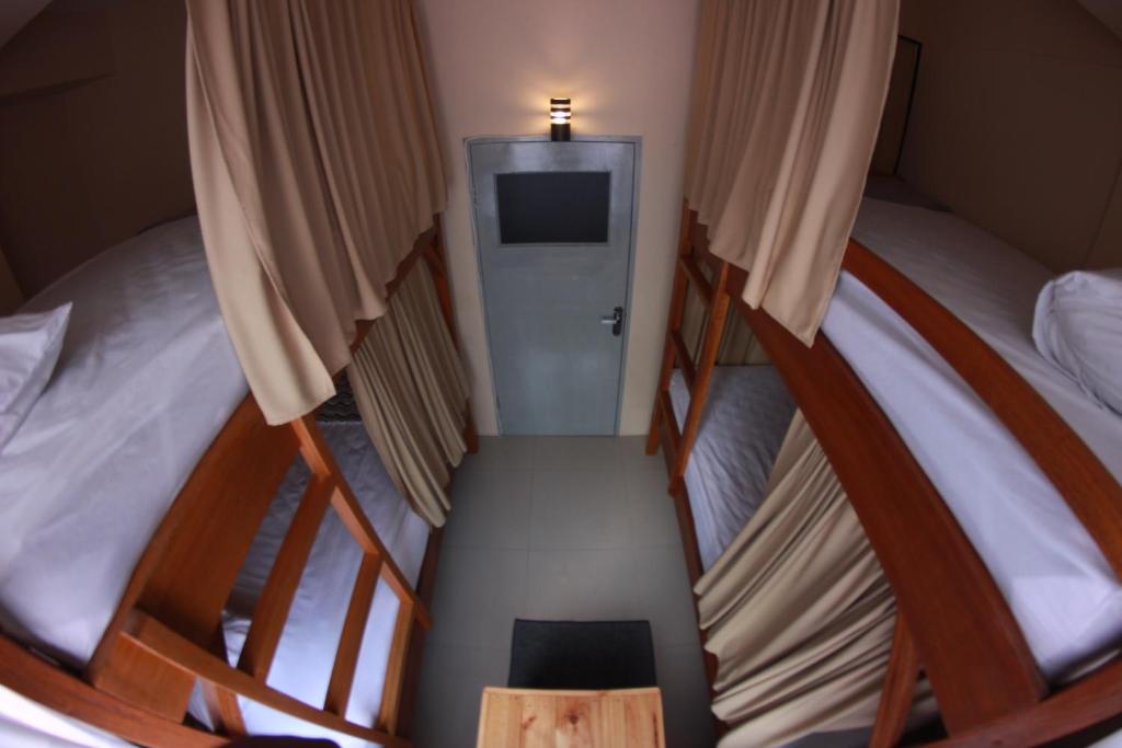 Postel nebo postele na pokoji v ubytování Kokos Hostel Padang City
