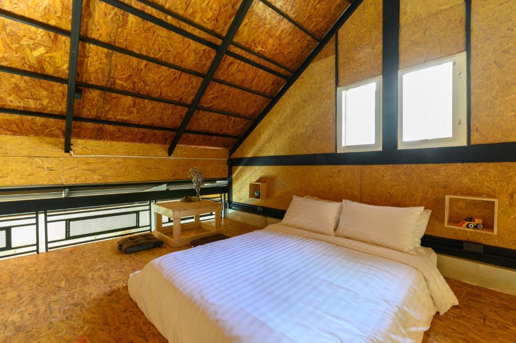 Postel nebo postele na pokoji v ubytování Loftpical Resort