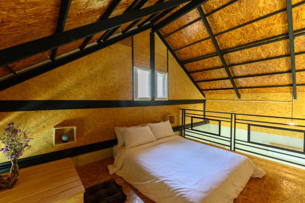 Postel nebo postele na pokoji v ubytování Loftpical Resort