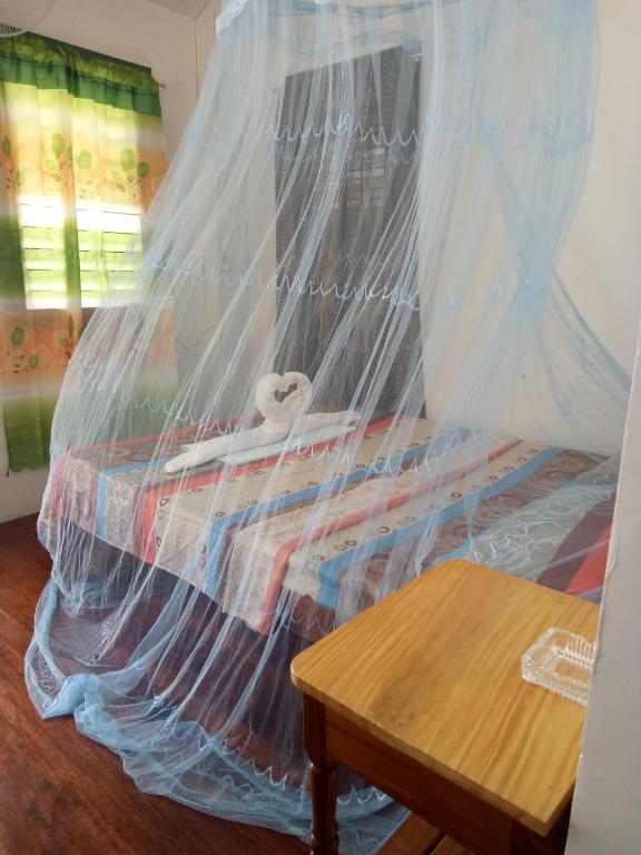 Postel nebo postele na pokoji v ubytování Jeno Tourist Inn