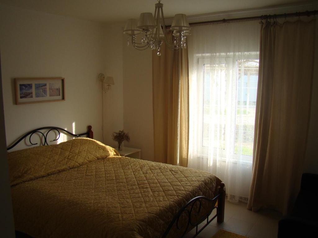 En eller flere senge i et værelse på Гостевой дом "VillaPetra"