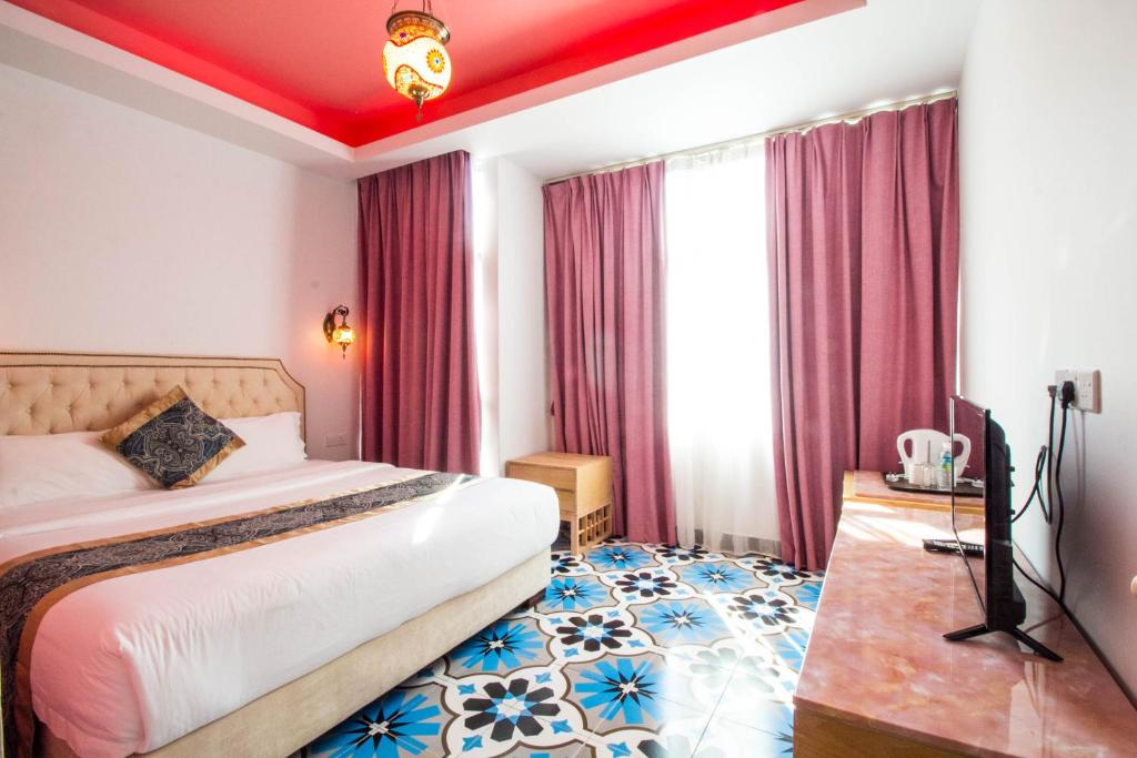 Postel nebo postele na pokoji v ubytování Hotel Hilal