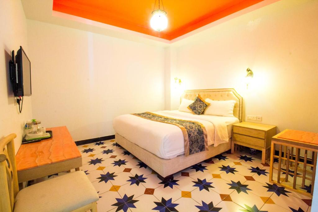 Postel nebo postele na pokoji v ubytování Hotel Hilal