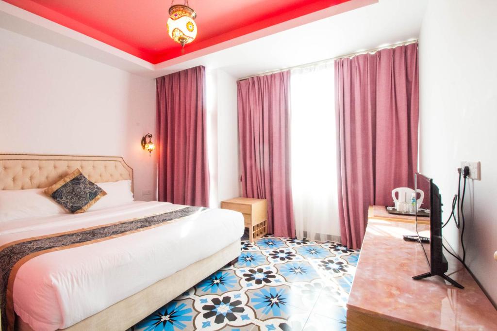 Postel nebo postele na pokoji v ubytování Hotel Hilal