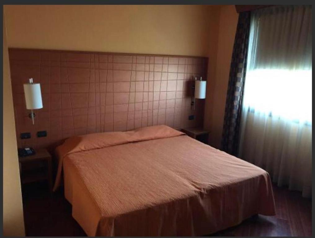 Postel nebo postele na pokoji v ubytování Laghi Room Only