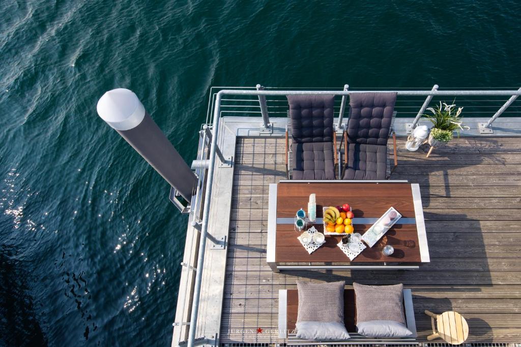 an aerial view of a deck of a boat in the water at Tokai in Olpenitz