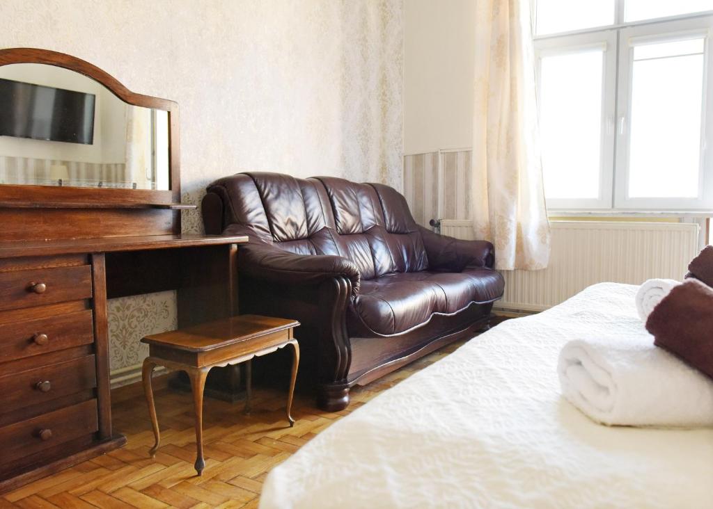 Posteľ alebo postele v izbe v ubytovaní Apartament City, Clock