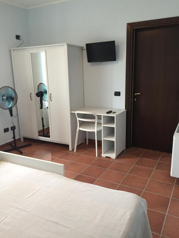 Łóżko lub łóżka w pokoju w obiekcie Agriturismo La Farazzina