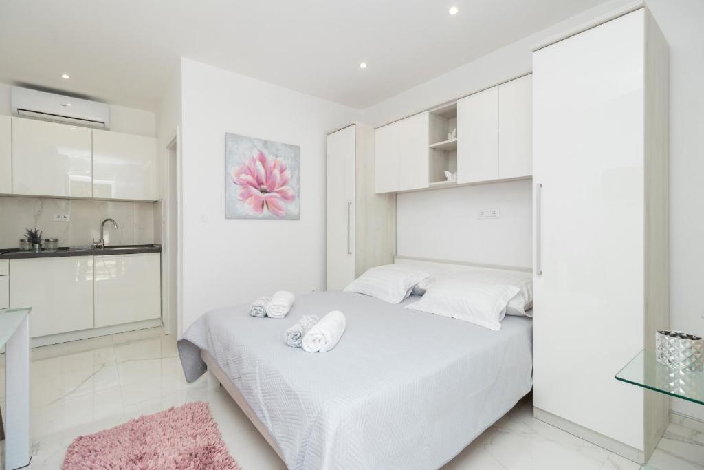Postel nebo postele na pokoji v ubytování Apartments D&A