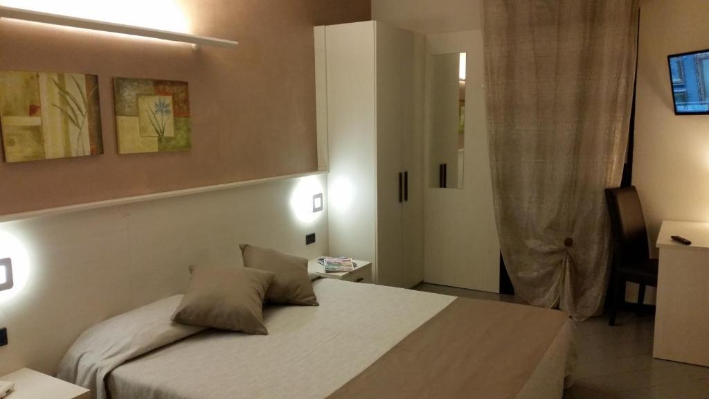 Postel nebo postele na pokoji v ubytování Albergo Al Cacciatore