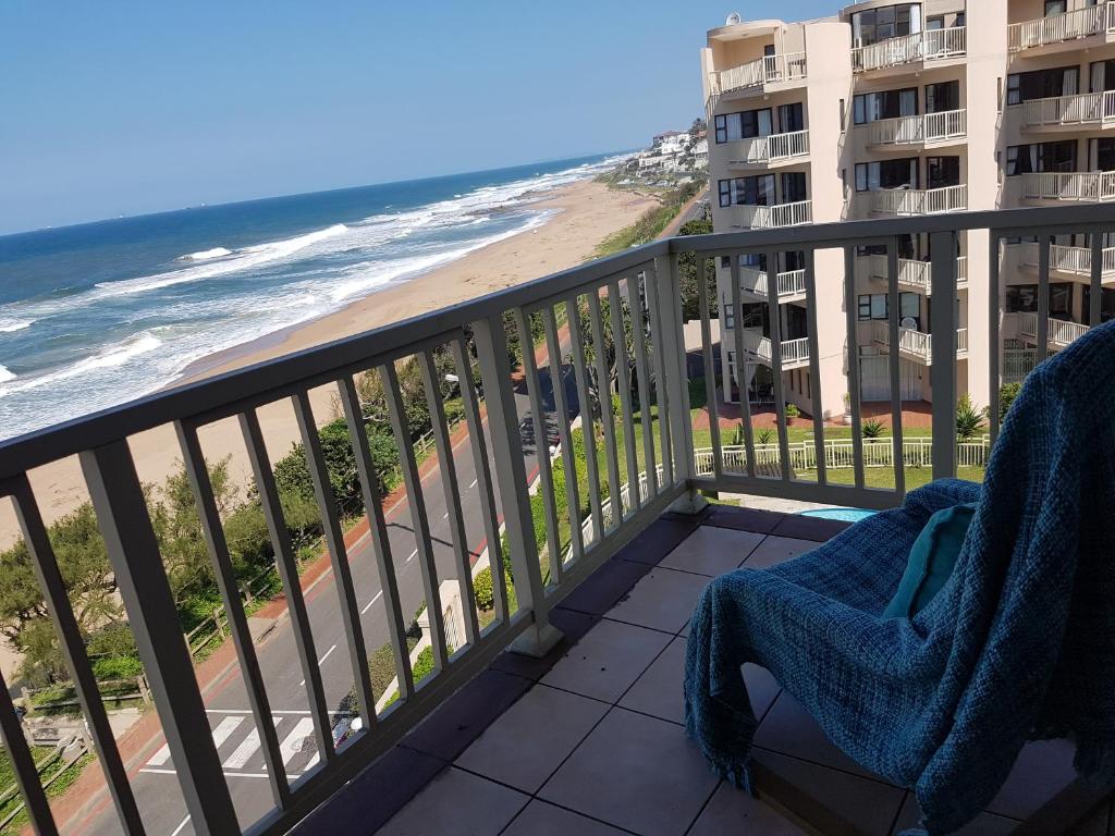 a balcony with a view of the beach at Umdloti Beach Apartment in Umdloti