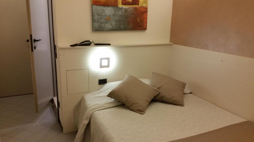 Postel nebo postele na pokoji v ubytování Albergo Al Cacciatore