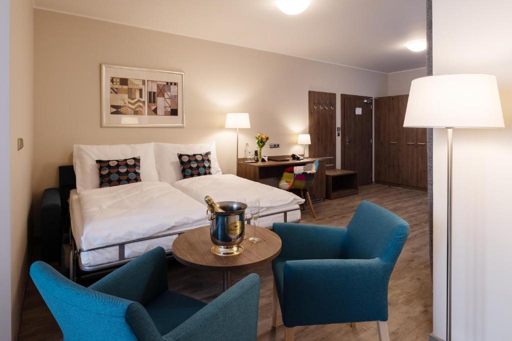Łóżko lub łóżka w pokoju w obiekcie Hotel Melantrich