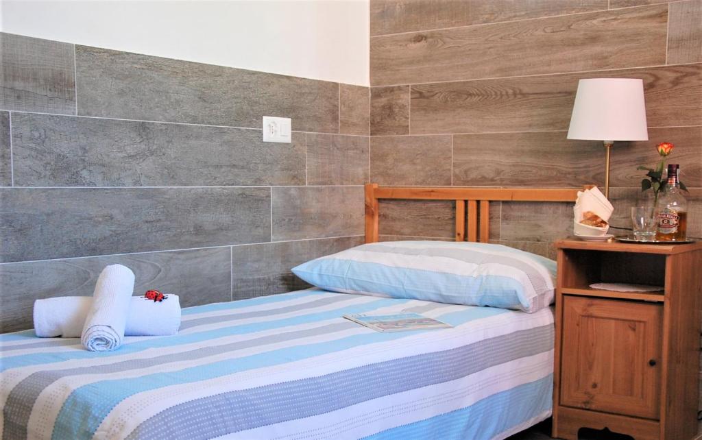 Postel nebo postele na pokoji v ubytování Hotel della Posta