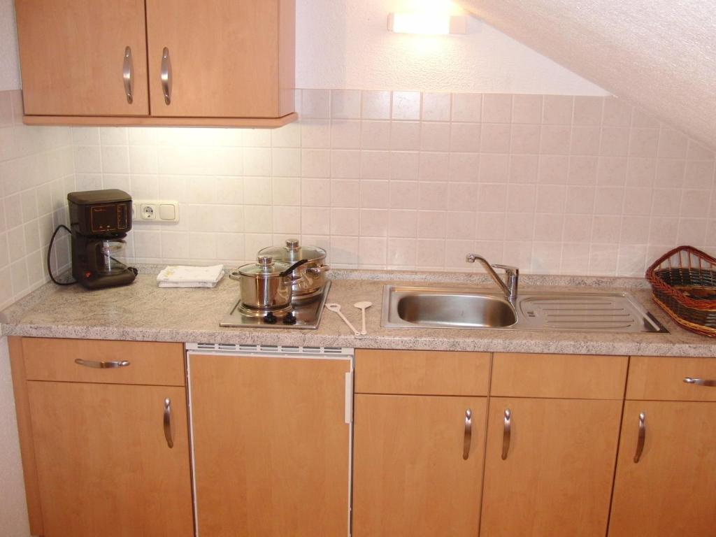 Kuchyň nebo kuchyňský kout v ubytování Gästehaus Auerstüble
