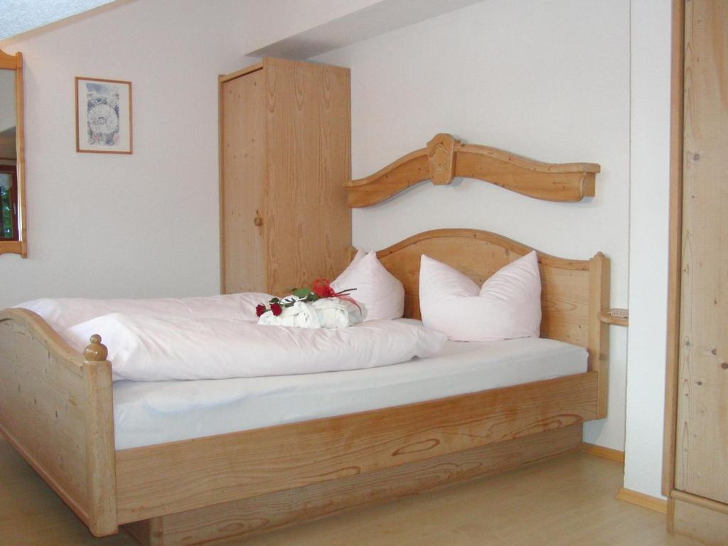 Postel nebo postele na pokoji v ubytování Gästehaus Auerstüble