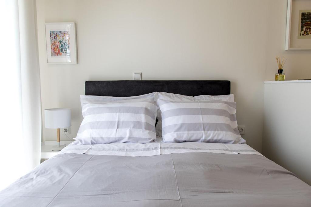 Posteľ alebo postele v izbe v ubytovaní The Modern Suite