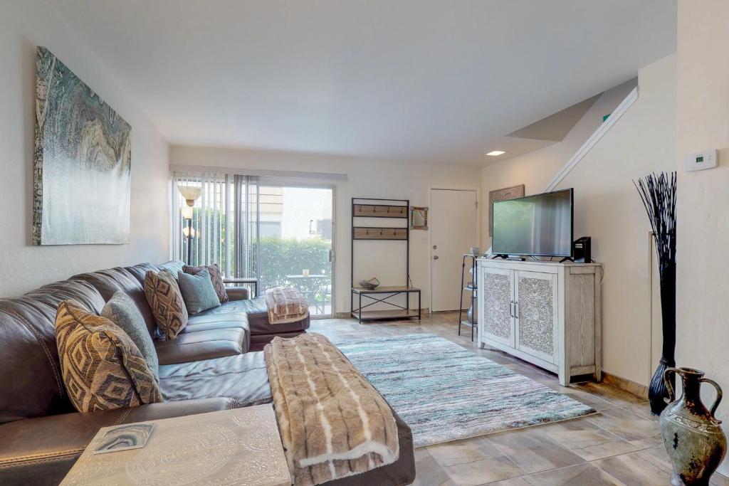 a living room with a couch and a tv at 2 Bed 2 Bath Vacation home in Scottsdale in Scottsdale