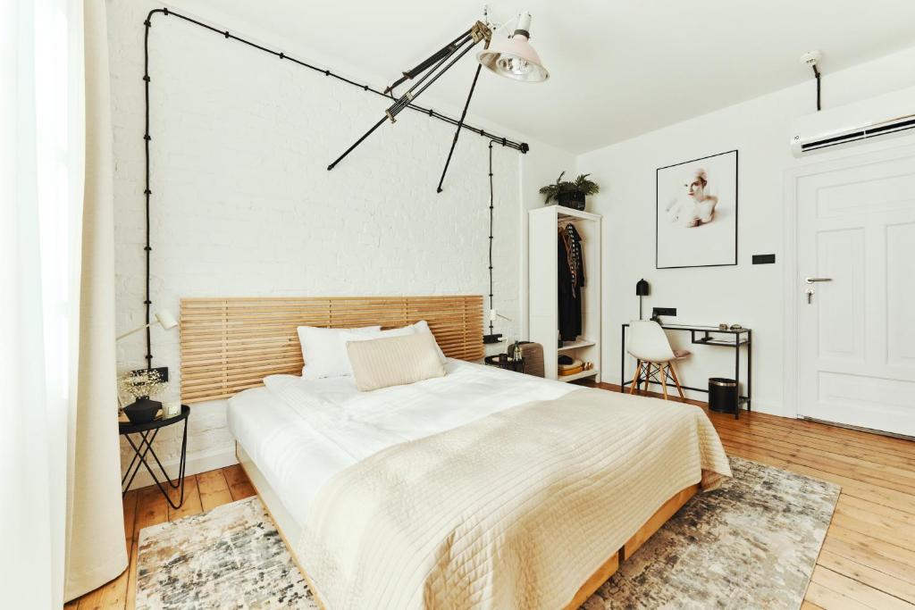 Posteľ alebo postele v izbe v ubytovaní ARTHOTEL STALOWA 52