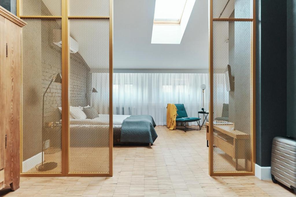 Posteľ alebo postele v izbe v ubytovaní ARTHOTEL STALOWA 52