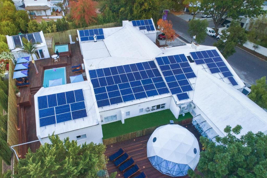 an aerial view of a house with solar panels on it at theLAB Franschhoek in Franschhoek