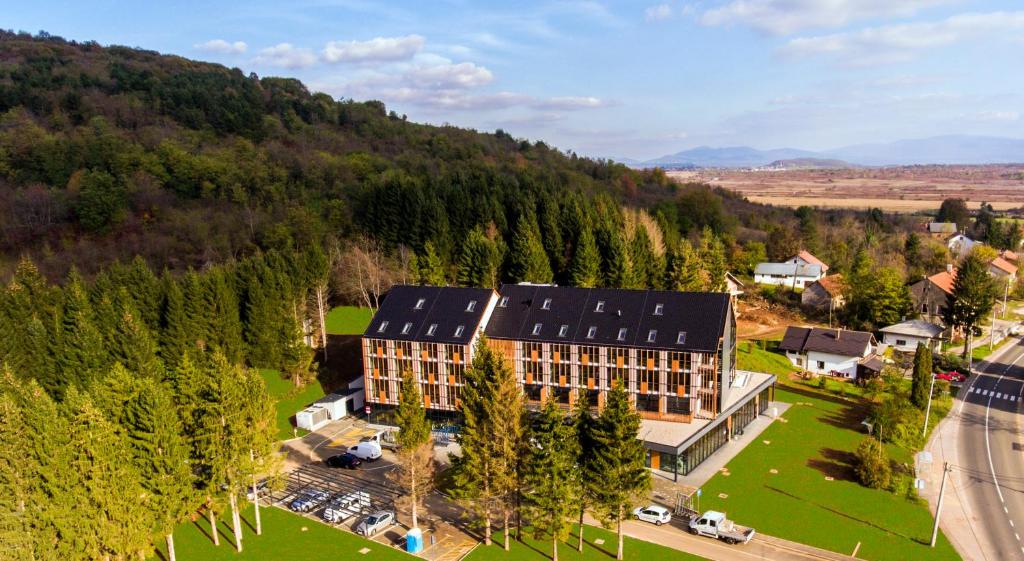 an aerial view of a building in the mountains at Lyra Hotel Plitvice in Ličko Petrovo Selo