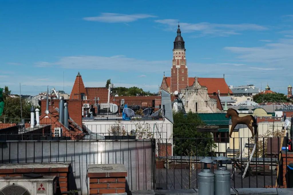 a view of a city with a clock tower at Duplex apartment in the center of Krakow in Krakow