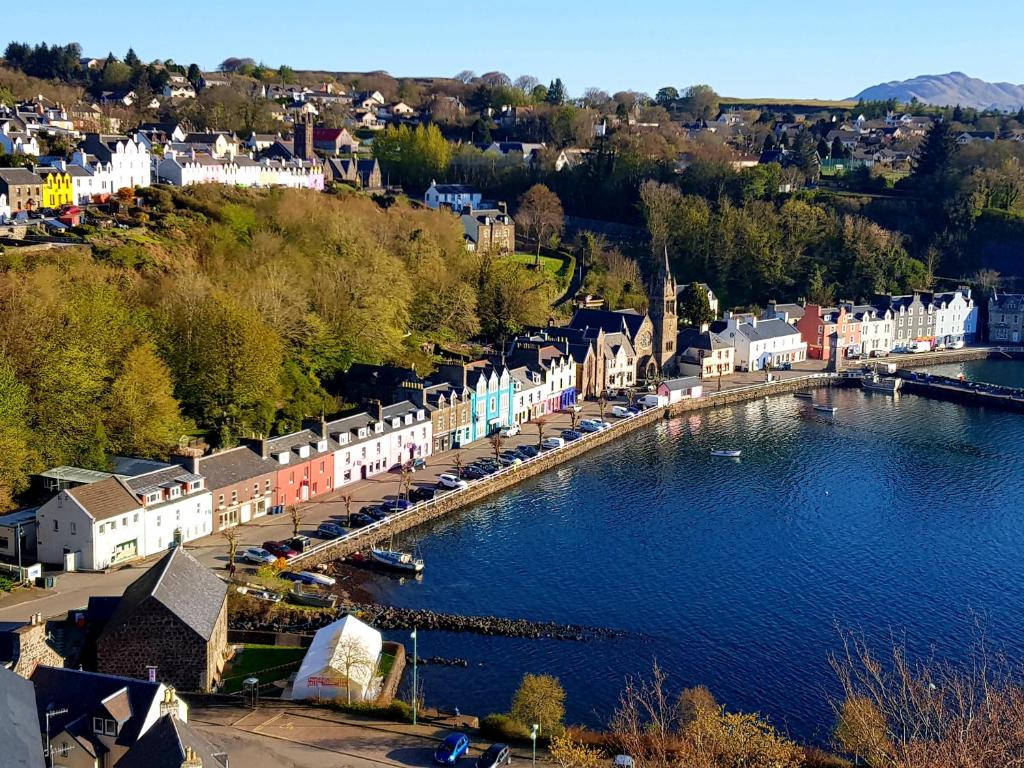 an aerial view of a town next to a body of water at Kirk Cottage in Tobermory