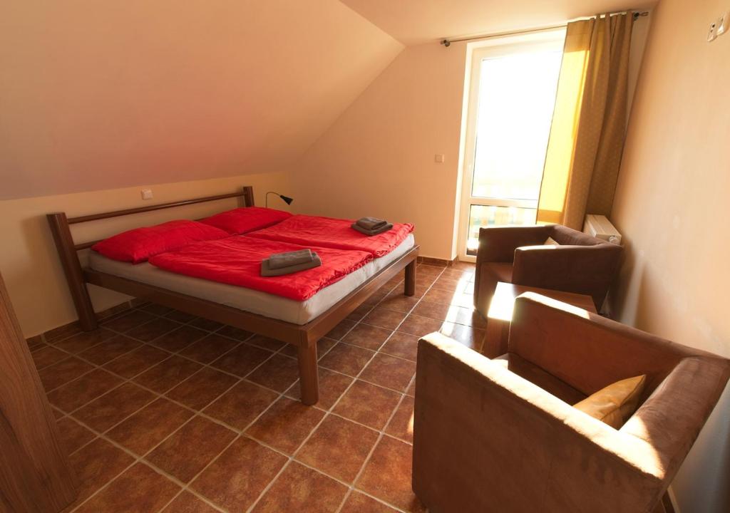 Postel nebo postele na pokoji v ubytování Penzion Rožmberk