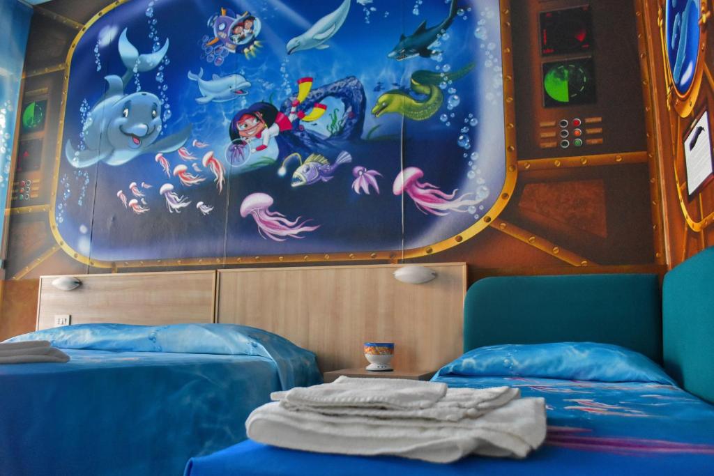 Postel nebo postele na pokoji v ubytování Hotel Bahamas